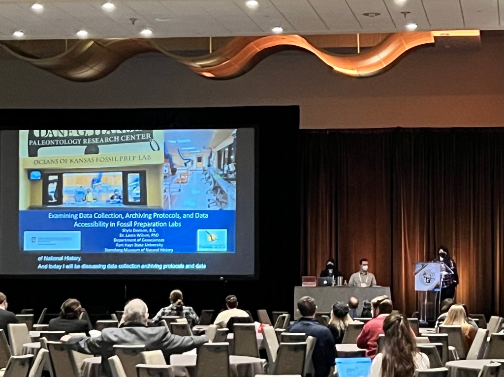 FHSU Geosciences graduate student Shyla Davison giving a platform presentation at the 2022 Society of Vertebrate Paleontology annual meeting in Toronto, Canada. 